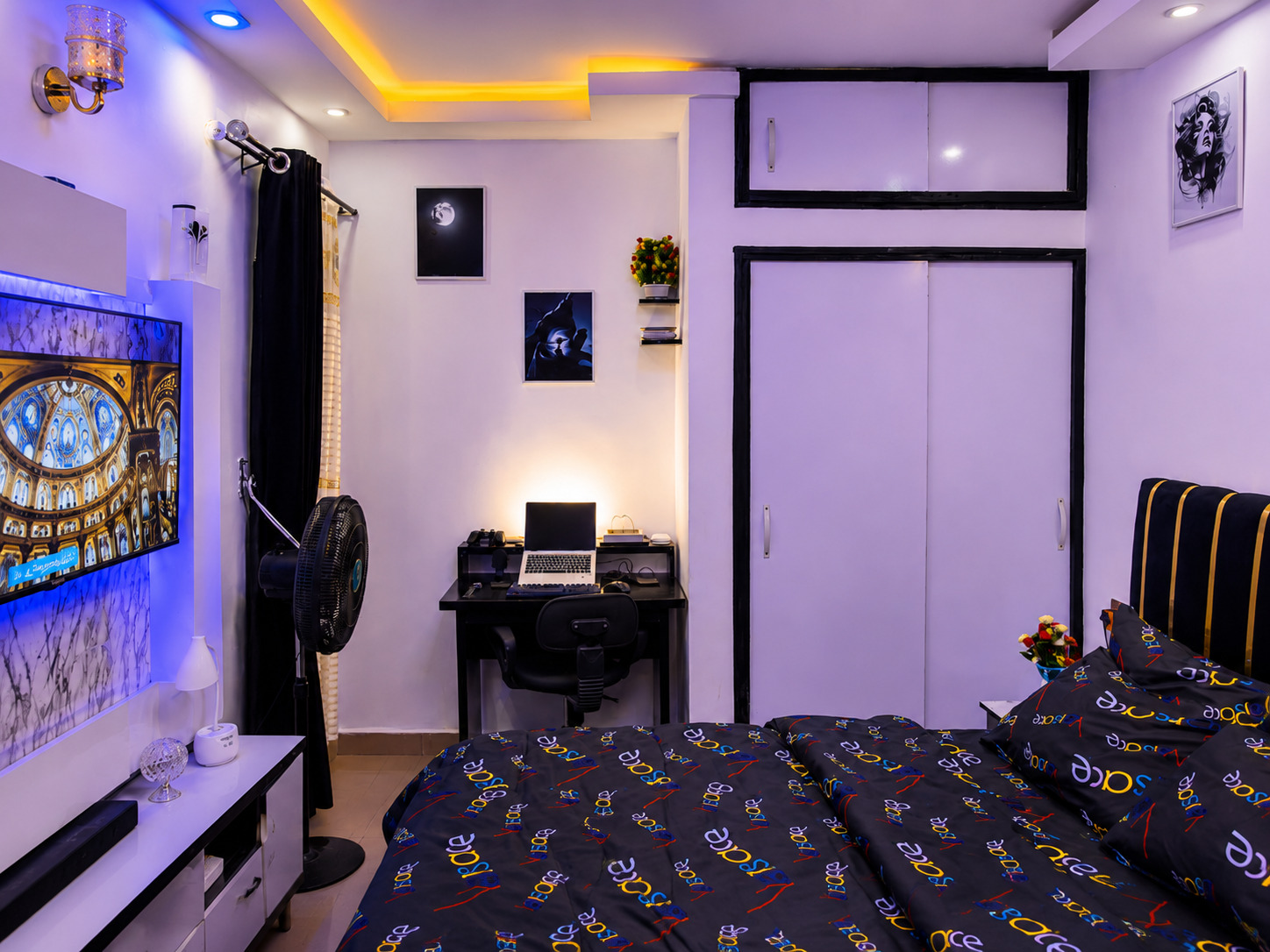 Elegant bedroom and workspace at Elite Comfort Apartment